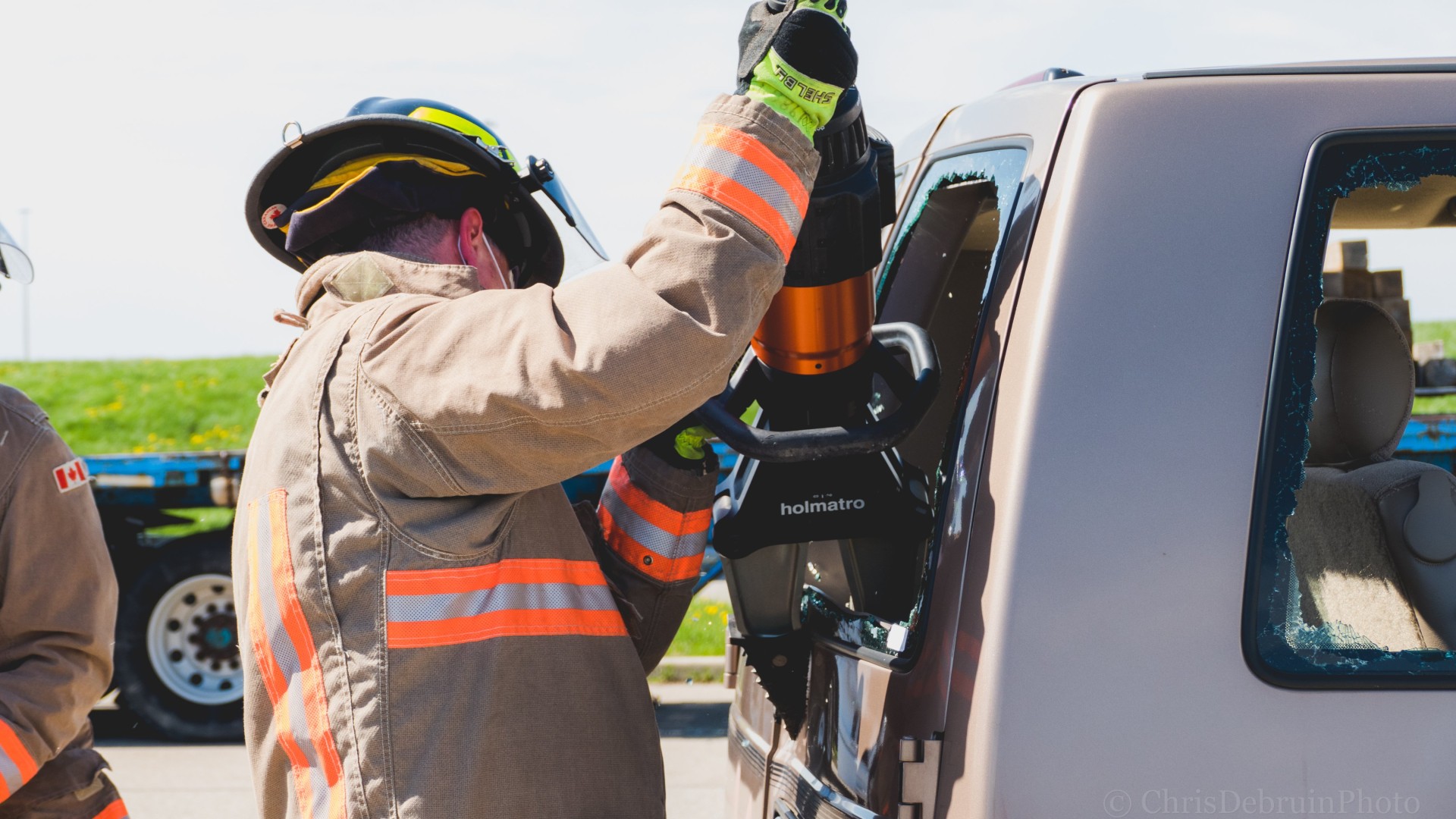 Firefighter training how to evacuate a vehicle.